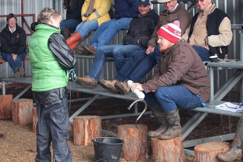 Dr Viv Perry talking with producers at a field day